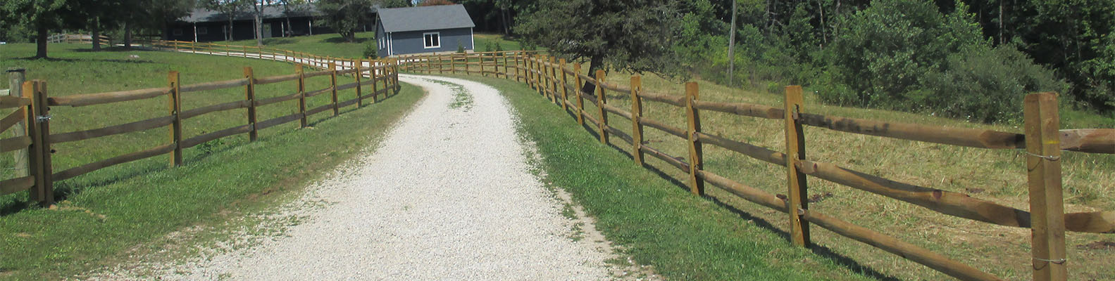 gravel road and wood fence