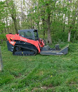 tractor removing brush